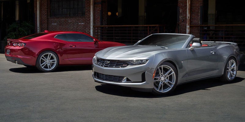 silver and red 2021 chevy camaros
